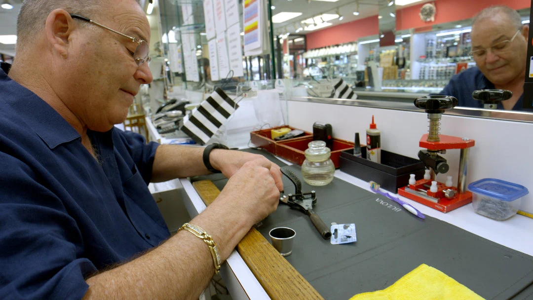 Salermo jeweler working on jewelry at a service bench